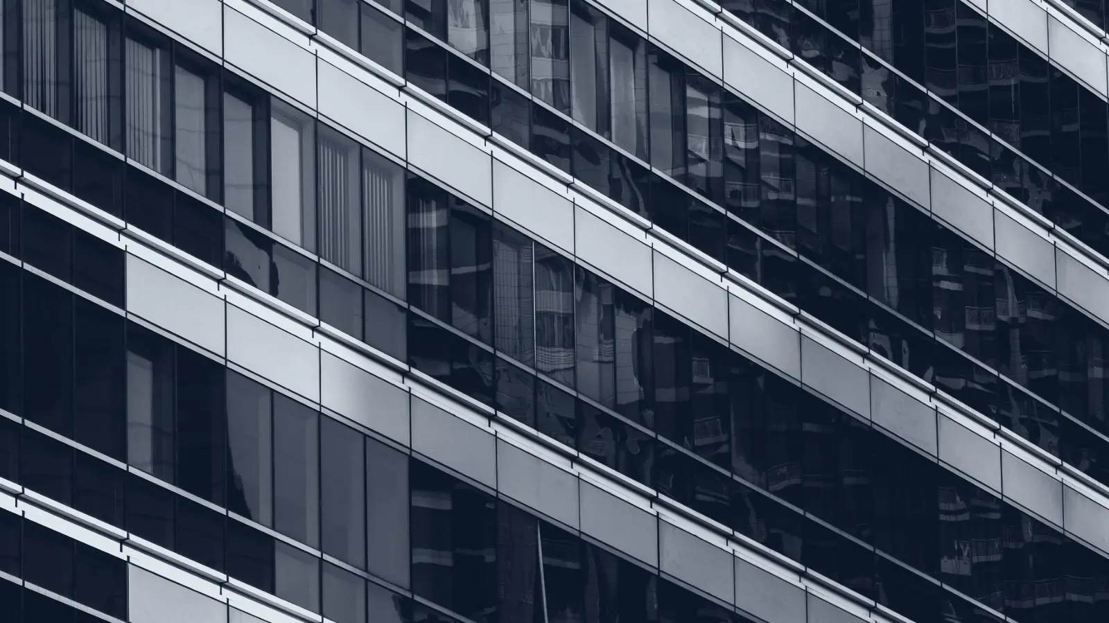The curtain-wall facade of a financial-district office tower.