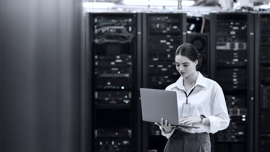 An engineer at work inside a live data hall.