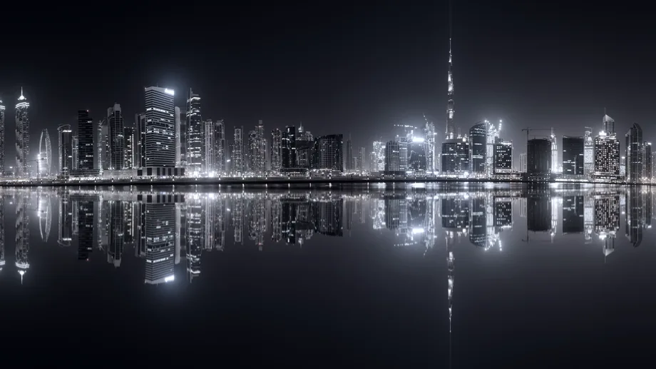 A financial-district skyline lit after dark.